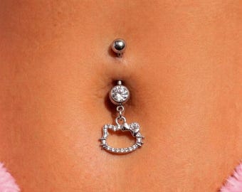 Piercing para ombligo de acero quirúrgico con forma de gatito kawaii y circonita cúbica estilo Y2K. Joya hipoalergénica y antialérgica.