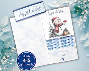 May include: A white gift card holder featuring a snowman illustration with a red hat and scarf, the text Happy Holidays, and a pull tab. The holder includes a blue banner with the text Happy Holidays and a blue circle stating Holds 4-5 gift cards.