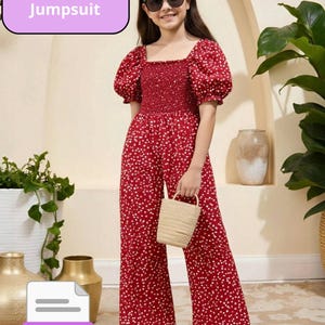 May include: A red jumpsuit with white floral print, featuring a square neckline and puffed sleeves. The text "Sewing Pattern Jumpsuit" is displayed. The outfit is paired with white sandals and a small woven handbag. A PDF icon is also visible.