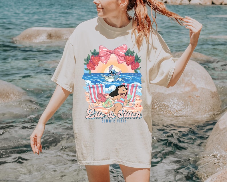 lilo and stitch summer vibes beach graphic shirt tropical vacation tee with cute beach aesthetic hawaii inspired summer sweatshirt with cartoon artwork beach vacation hoodie for tropical summer outfits cute disney inspired beach vibes t shirt coquette tropical graphic tee with strawberries and bow summer vacation outfit with tropical cartoon design beach themed summer apparel for disney lovers