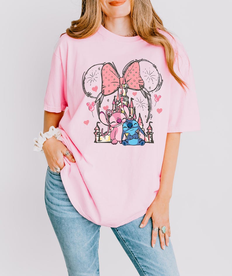 Stitch Angel castle shirt with Minnie ears and pink bow design Disney couple shirt with Stitch and Angel inspired characters pink Disney vacation tee with castle hearts and fireworks Minnie ears castle shirt with cute Stitch Angel graphic theme park outfit shirt with magical castle and pink bow Stitch and Angel Disney shirt for couple vacation outfit cute Disney lover gift shirt with castle and hearts design white Disney inspired graphic tee with Stitch Angel artwork