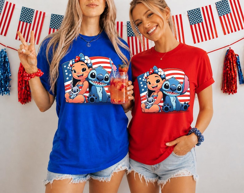 May include: Two people wearing blue and red t-shirts featuring a cartoon image of Lilo and Stitch with an American flag background. The shirts are paired with denim shorts. The background includes American flags and festive decorations.