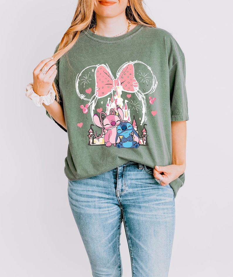 Stitch Angel castle shirt with Minnie ears and pink bow design Disney couple shirt with Stitch and Angel inspired characters pink Disney vacation tee with castle hearts and fireworks Minnie ears castle shirt with cute Stitch Angel graphic theme park outfit shirt with magical castle and pink bow Stitch and Angel Disney shirt for couple vacation outfit cute Disney lover gift shirt with castle and hearts design white Disney inspired graphic tee with Stitch Angel artwork
