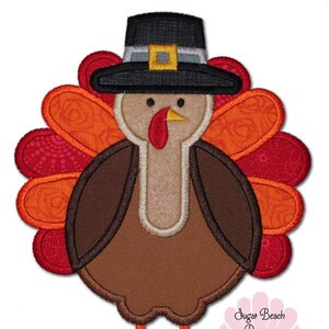 May include: Applique design of a Thanksgiving turkey wearing a pilgrim hat. The turkey is brown with a red wattle and yellow beak. The turkey has orange and red feathers. The design is perfect for embroidery projects.