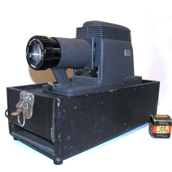 Items similar to Mid Century argus slide projector with case on Etsy