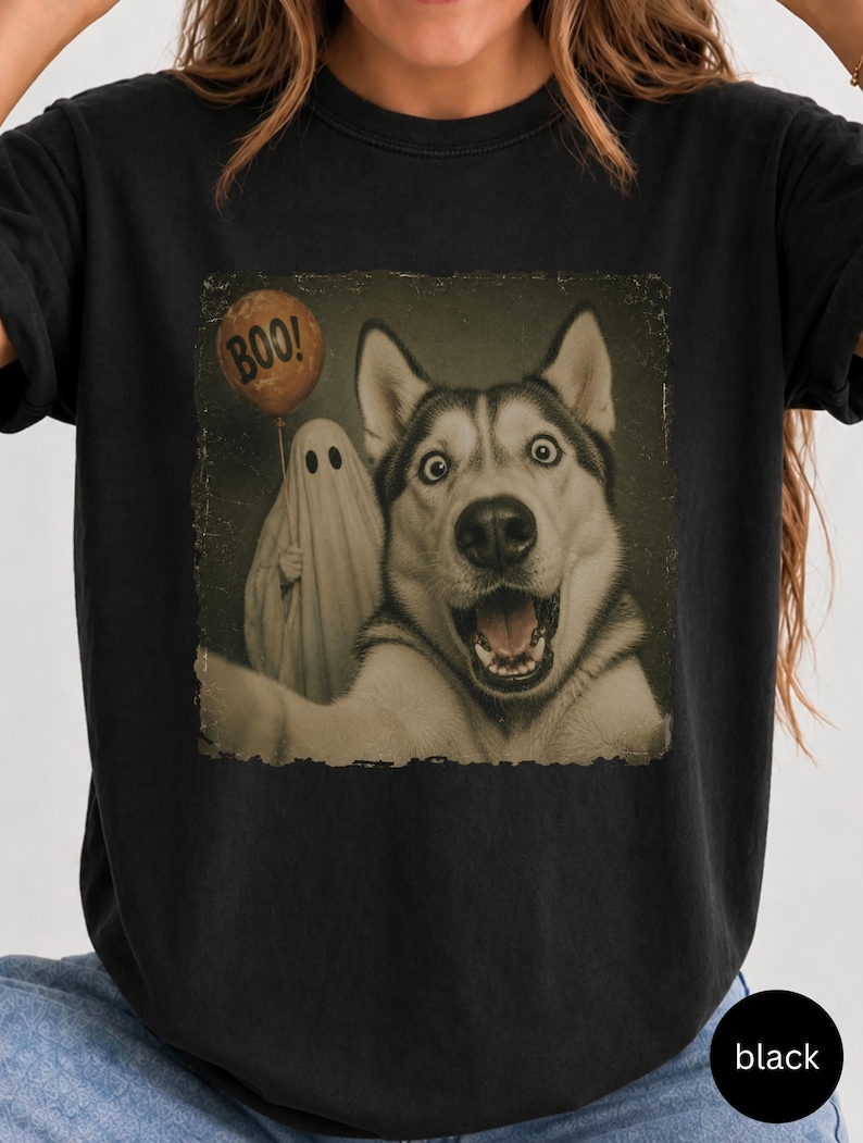 Startled Husky taking a Halloween selfie with a sheet ghost holding an orange BOO balloon in a distressed vintage photo design.