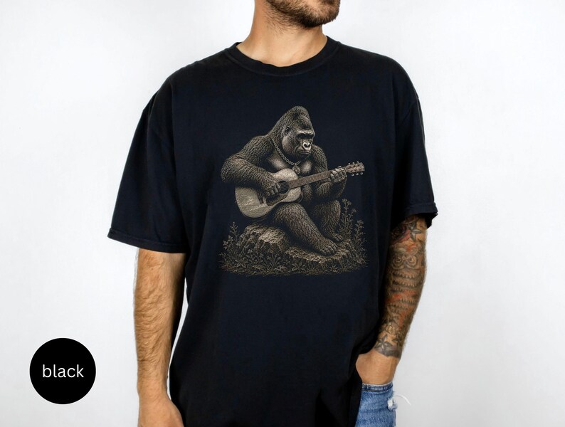 Detailed gorilla playing acoustic guitar while sitting on a rock, vintage engraving artwork for music lovers and guitar players.