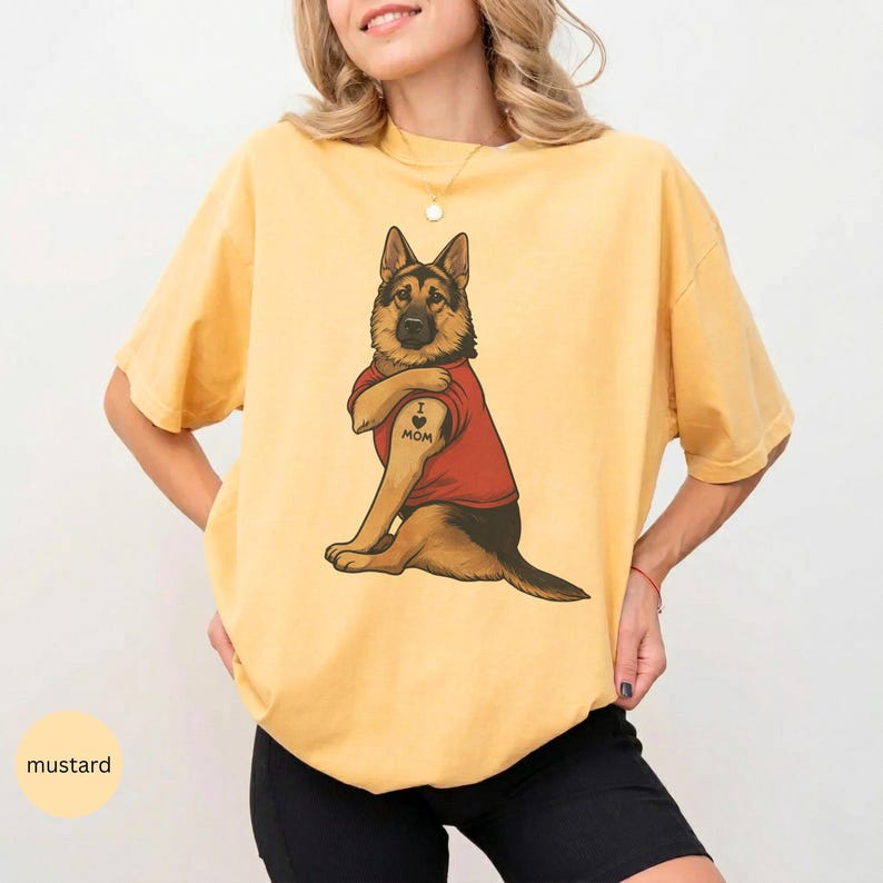 German Shepherd dog illustration wearing a red shirt, lifting sleeve to reveal “I love mom” tattoo, vintage style retro pet graphic, bold clean lines, centered composition, perfect for dog lovers and animal themed apparel designs