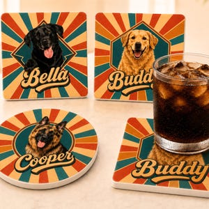 May include: Three square and one round drink coaster featuring a retro sunburst pattern in red, teal, and yellow. Each coaster displays a dog portrait and a name: Bella, Buddy, or Cooper. A glass filled with a dark beverage sits on one coaster.