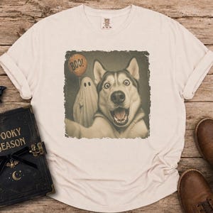 Startled Husky taking a Halloween selfie with a sheet ghost holding an orange BOO balloon in a distressed vintage photo design.