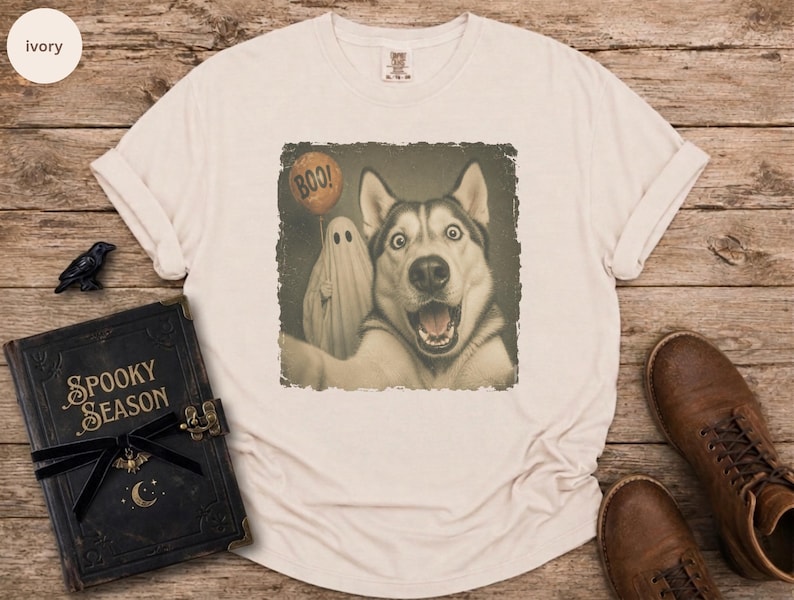 Startled Husky taking a Halloween selfie with a sheet ghost holding an orange BOO balloon in a distressed vintage photo design.