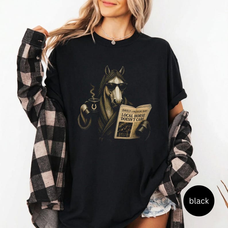 Vintage engraved horse wearing sunglasses and a robe while reading a newspaper and holding a steaming coffee mug. Humorous horse lover design featuring the headline “Local Horse Doesn't Care” in an antique newspaper style. Detailed equestrian artwork with a relaxed, unbothered attitude.