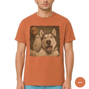 Startled Husky taking a Halloween selfie with a sheet ghost holding an orange BOO balloon in a distressed vintage photo design.