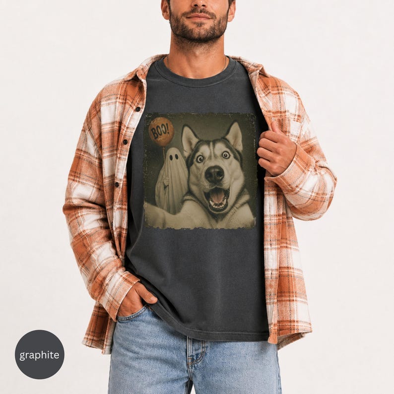 Startled Husky taking a Halloween selfie with a sheet ghost holding an orange BOO balloon in a distressed vintage photo design.