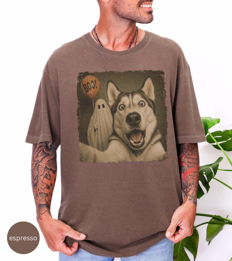 Startled Husky taking a Halloween selfie with a sheet ghost holding an orange BOO balloon in a distressed vintage photo design.