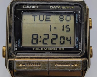 Relógio Casio DBC-63 Micro Cosmos Telememo 50 com Calculadora de
