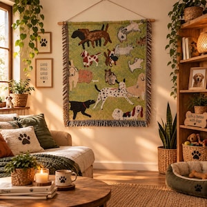 May include: A rectangular woven wall hanging featuring a light green background with a pattern of various dog breeds in different colours and poses. The textile piece has a fringed edge on the left and right sides and is suspended from a wooden rod.