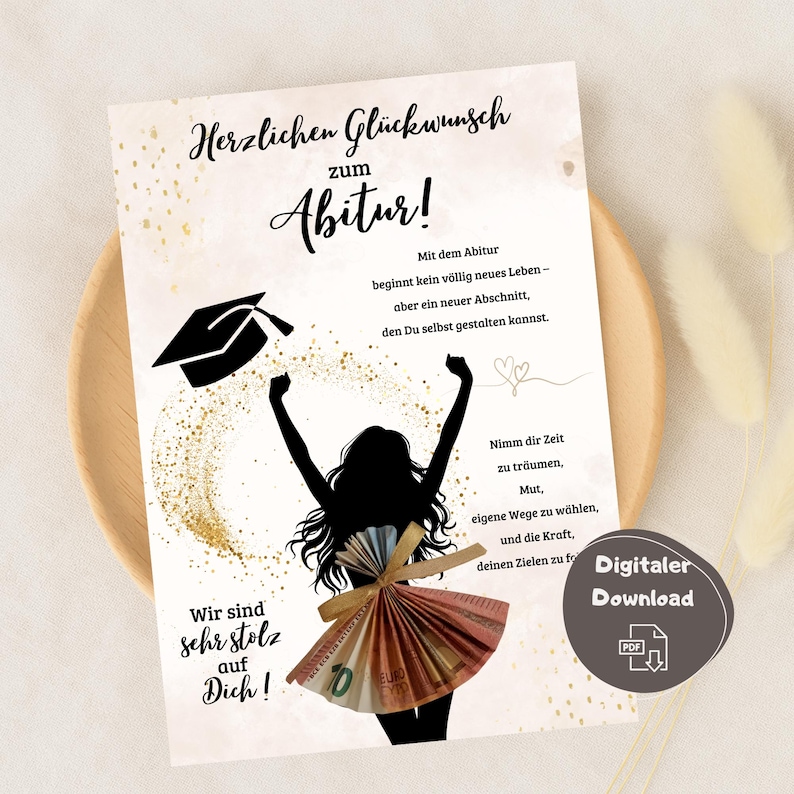 May include: A graduation card with the text "Herzlichen Gl&uuml;ckwunsch zum Abitur!" and a silhouette of a person celebrating. The person's dress is made of folded Euro bills. The card also includes the words "Wir sind sehr stolz auf Dich!"