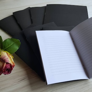 Handmade Notebooks and Journals with black card covers. Add your own vinyl cut lettering. Make notes, use as gifts, fill event bags.