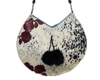 SALE (was 178.00) --Large round black/white hair-on cowhide bag with tooled red leather roses and fur pompoms