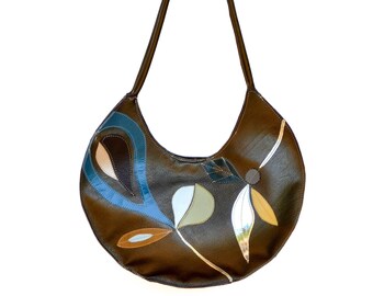 Large round antique bronze pebbled leather bag with hand cut leaf collage in mid mod colors