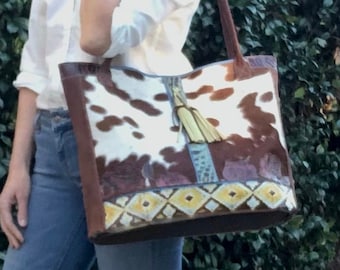 XL brown and white hair-on cowhide tote with colorful tooled leather trim