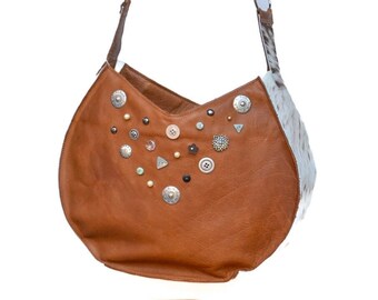 SALE** (was 188.00) --Large rounded cowhide leather canteen bag with silver and pearl studs and hair-on leather sides