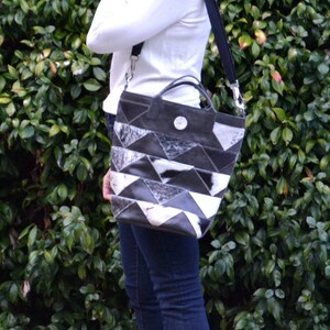 Large hair-on cowhide chevron patchwork tote in black and white with short handles and adjustable shoulder strap
