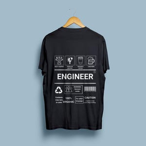 May include: Black t-shirt with a white graphic design that says "Engineer" and includes icons for multitasking, problem solving, coffee, and beer. The text also says "Contents may vary in colour, 100% Organic, Warning: Sarcasm Inside, For adult language, Caution: Long hours may cause binge drinking."