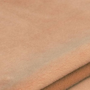Soft plush fabric texture of race car pillow, close-up of cozy velvet-like material, gentle on child skin