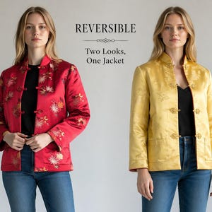 May include: Reversible jacket in red with floral embroidery and a gold-yellow side. The jacket has a mandarin collar and frog closures. The text reads: "REVERSIBLE Two Looks, One Jacket."