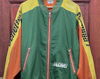 May include: A vintage racing-style jacket in green, yellow, and orange. The jacket features a full-length red zipper, two zippered pockets, and the word "RACING" printed across the chest. The sleeves have a black and yellow design.