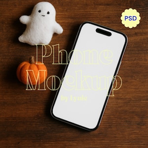 May include: A smartphone mockup with a blank white screen, a felt ghost, and an orange pumpkin on a wooden surface. The text "Phone Mockup" is overlaid on the image, along with the text "by lyuie". A yellow flower-shaped icon with the text "PSD" is in the upper right corner.