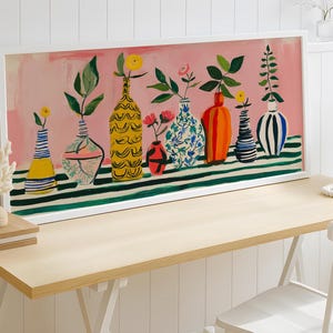 a painting on a wall next to a table