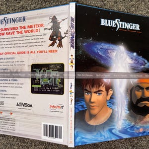 May include: A Blue Stinger official strategy guide for the Sega Dreamcast. The front cover features two male characters and a glowing figure over blue water. The back cover includes game text, a creature illustration, and a map graphic.