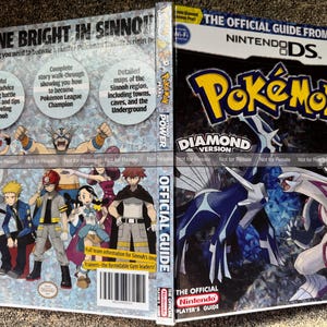 May include: A Nintendo DS Pokemon Diamond and Pearl official strategy guide book. The cover features the Pokemon Dialga and Palkia, the title logo, and the text Shine Bright in Sinnoh. The back displays various Pokemon trainer characters.