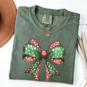 Comfort Colors®  Christmas Bow Shirt, Coquette Christmas Bow Tee, Holiday T-Shirt, Holiday Party Tee,Family Xmas Party Tee