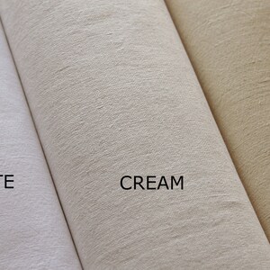 May include: Three fabric swatches in different shades of white: white, cream, and ecru.