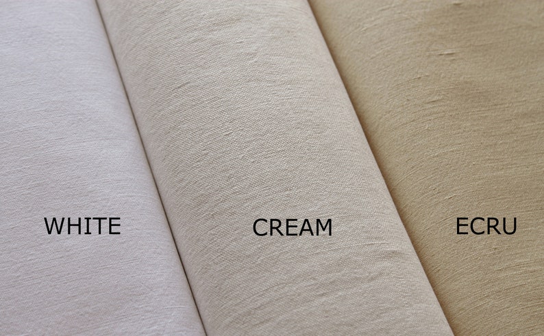 May include: Three fabric swatches in different shades of white: white, cream, and ecru.