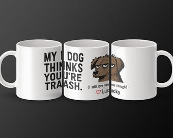 May include: White ceramic mug with a black and white illustration of a dog with the text "MY DOG THINKS YOU'RE TRAASH. (I still love you though.) Lucky"