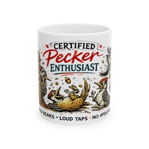 May include: White ceramic mug with a cartoon illustration of several woodpeckers. The mug features the text "CERTIFIED Pecker ENTHUSIAST" in red and green, with additional text at the bottom. The woodpeckers are in various poses.
