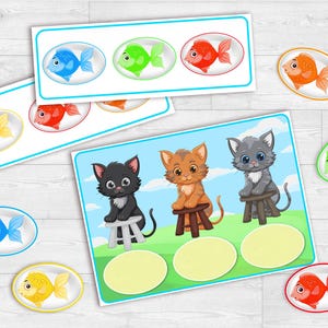 Puede incluir: Tarjetas did&aacute;cticas con peces y gatitos de dibujos animados. Las tarjetas presentan peces azules, verdes, rojos y amarillos. Las tarjetas de gatitos tienen un fondo de cielo azul y hierba verde. Medidas en cm.