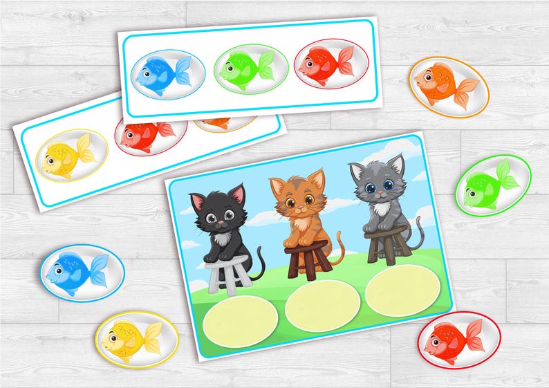 Puede incluir: Tarjetas did&aacute;cticas con peces y gatitos de dibujos animados. Las tarjetas presentan peces azules, verdes, rojos y amarillos. Las tarjetas de gatitos tienen un fondo de cielo azul y hierba verde. Medidas en cm.