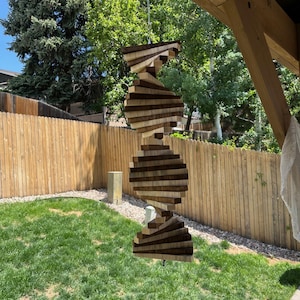 Dark and light wood wind spinner