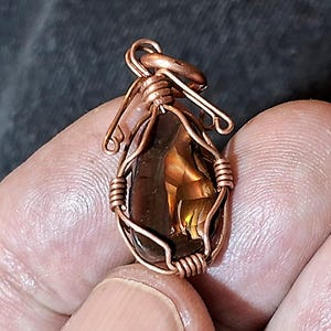 Amulet, Copper pendant with fire agate from Deer Creek, Arizona. Copper jewelry for protection.