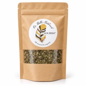 May include: A brown kraft paper stand-up pouch with a clear window revealing dried green herbs. The circular white label features the text Dr. Bella's Botanicals, NOURISH, and All natural & organic, accompanied by a graphic of a yellow and brown feather.