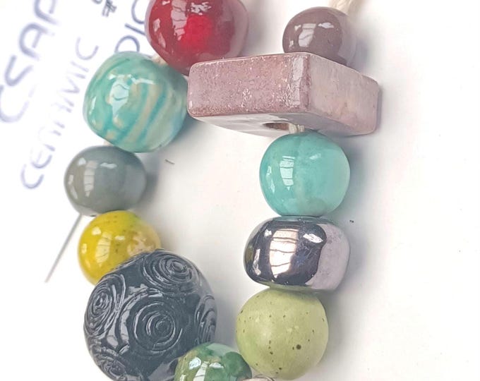 Unique Handmade   ceramic beads mixed colors 12 pcs           Each piece is filled with love and care, shaped by decades of experience.