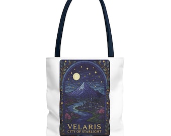 May include: A white tote bag with a stained glass design of a city skyline at night. The design features a mountain, a river, and a full moon. The text "VELARIS CITY OF STARLIGHT" is printed below the design.