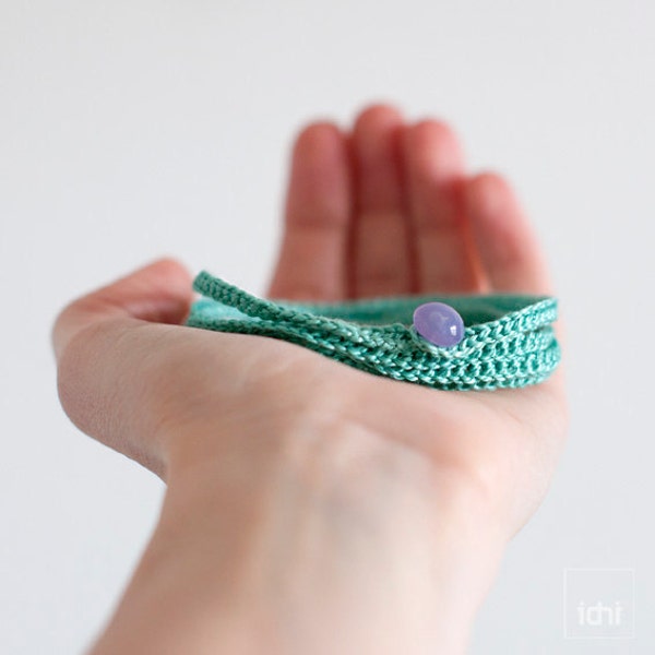 Crochet Bracelet . Pastel green with lilac button .
