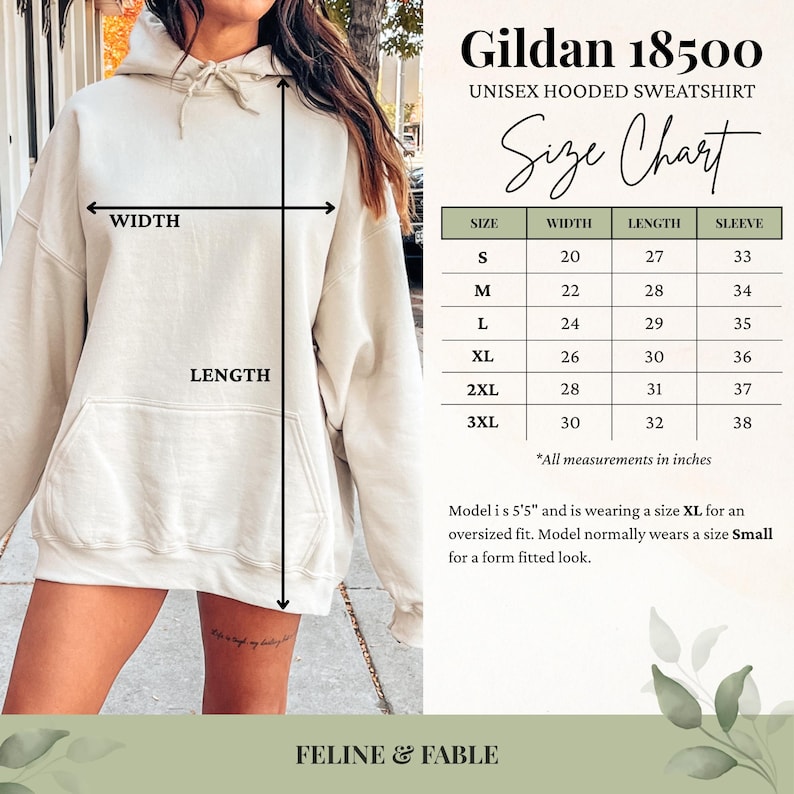 May include: A beige Gildan 18500 unisex hooded sweatshirt. The image includes a size chart with measurements in inches for sizes S to 3XL. The model is 5'5" and wearing an XL for an oversized fit. The brand name is Feline & Fable.